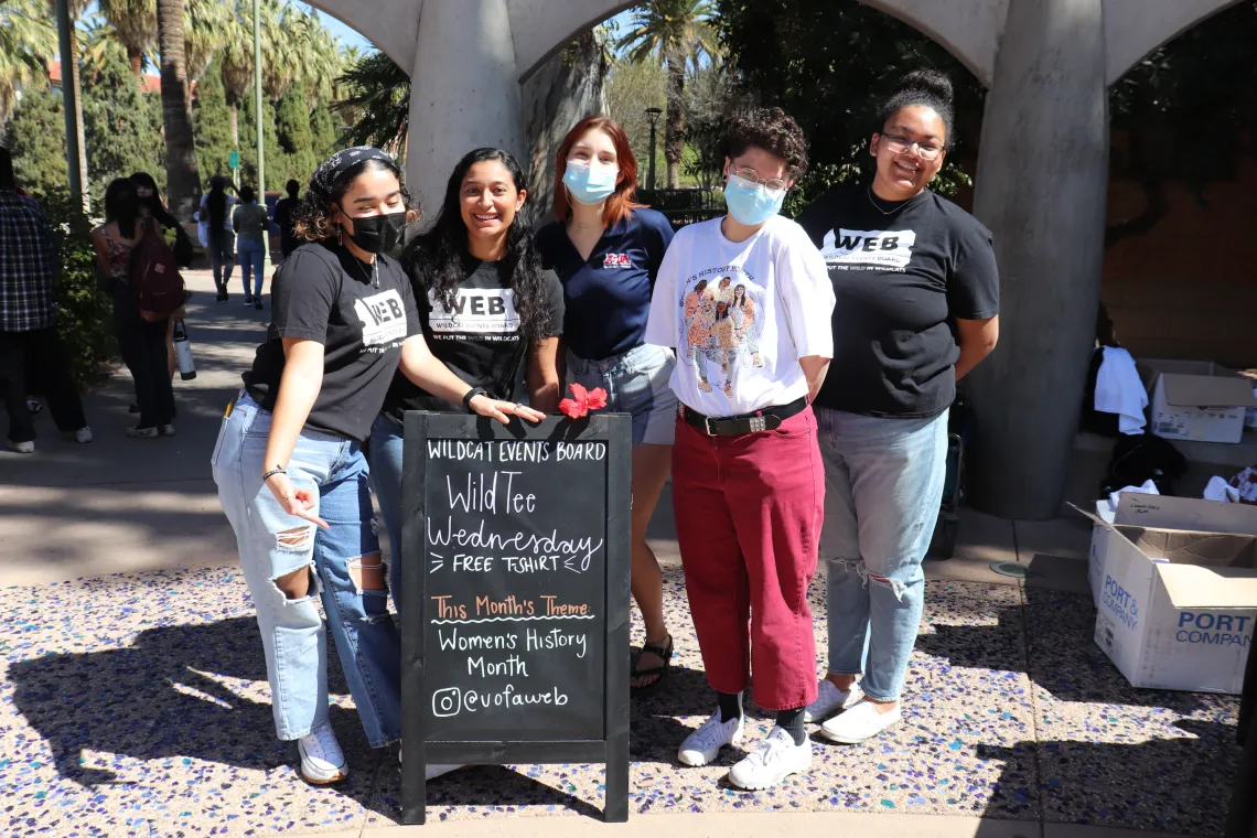 Students by sign for event