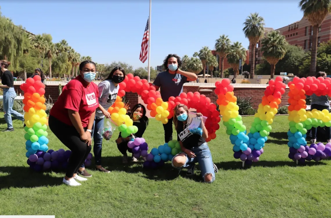 Students by LOVE colorful balloon sign